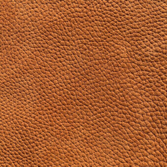 Nubuck leather texture, warm brown, pebble grain; dense pattern with raised bumps, matte finish, natural tonal variations, Cierre1972 sample.